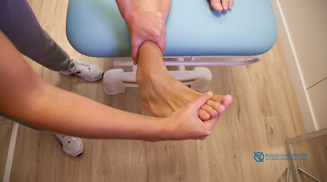 Chiropractor performing chiropractic care on patient's ankle