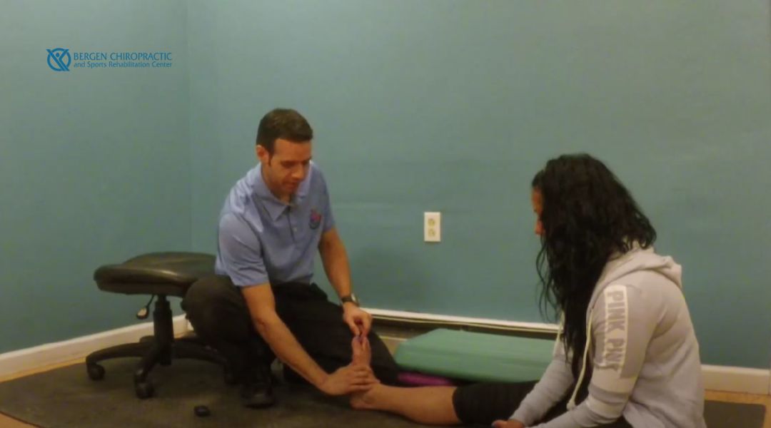 Dr. Doerr performing chiropractic care on patient's ankle