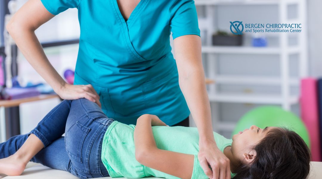 Chiropractor performing adjustments on child
