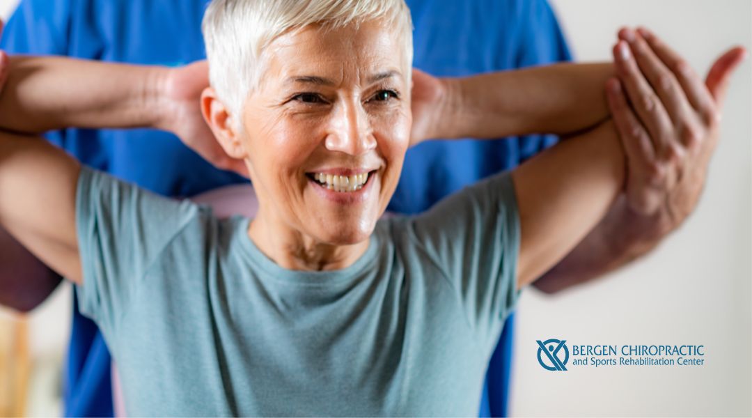 Happy female patient smiling during chiropractic care
