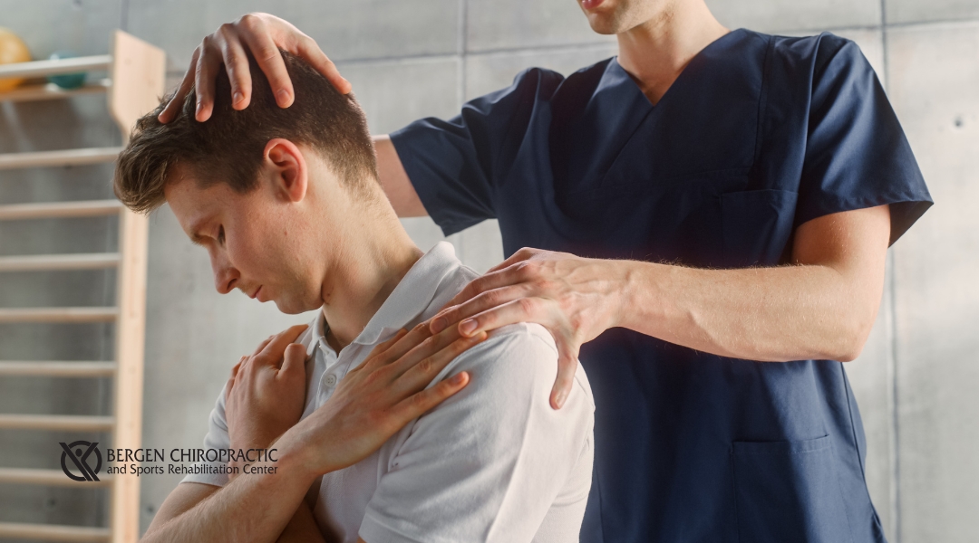Chiropractic adjustment on patient's back and neck