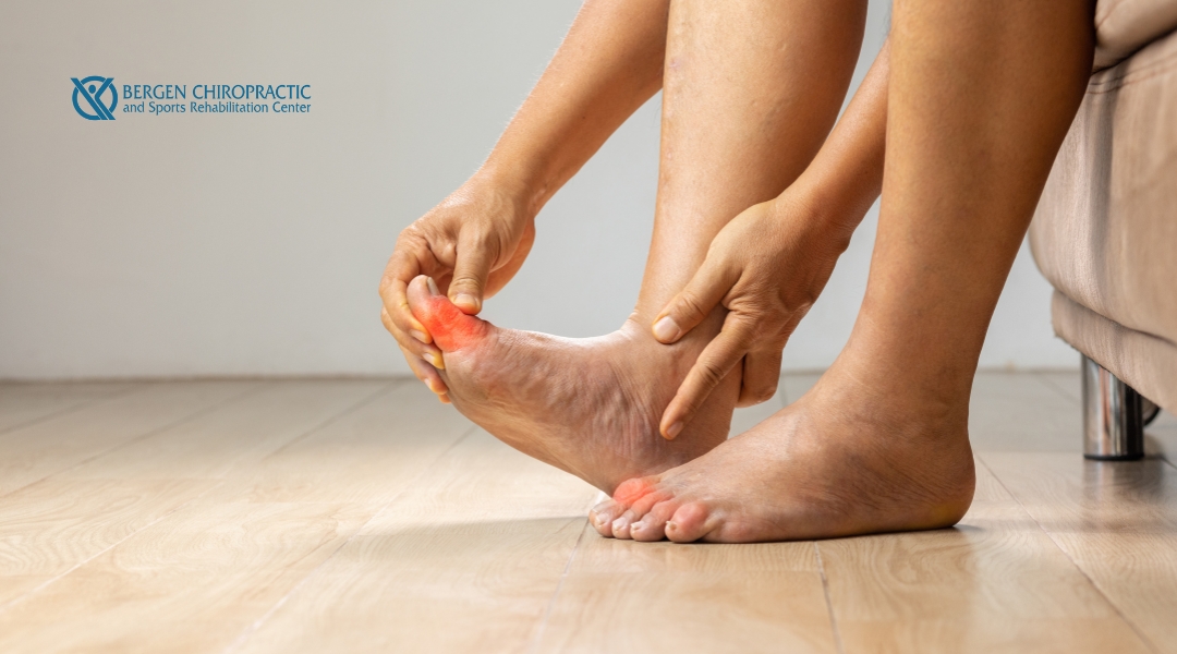 A person applying pressure to their foot due to discomfort or pain, possibly related to plantar fasciitis or foot strain.
